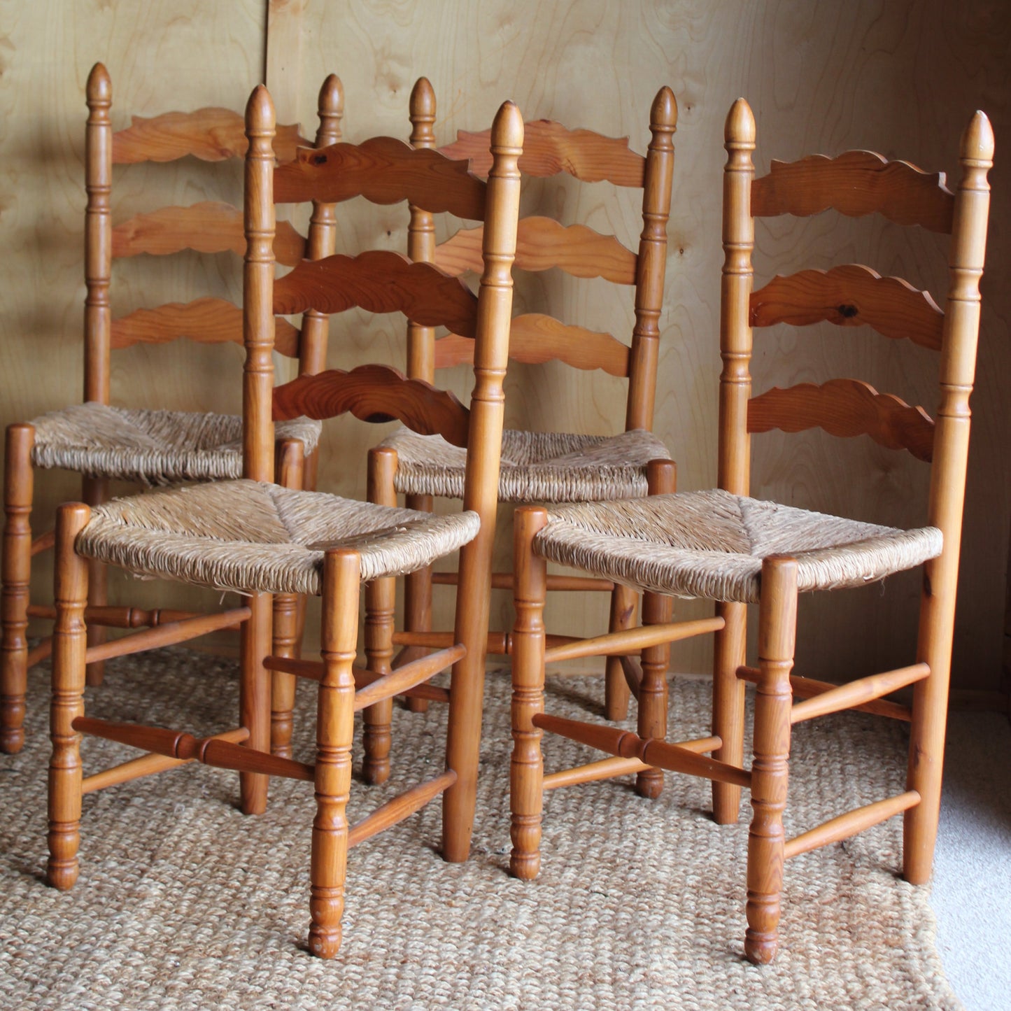 Wooden chair with woven backrest against a neutral wall