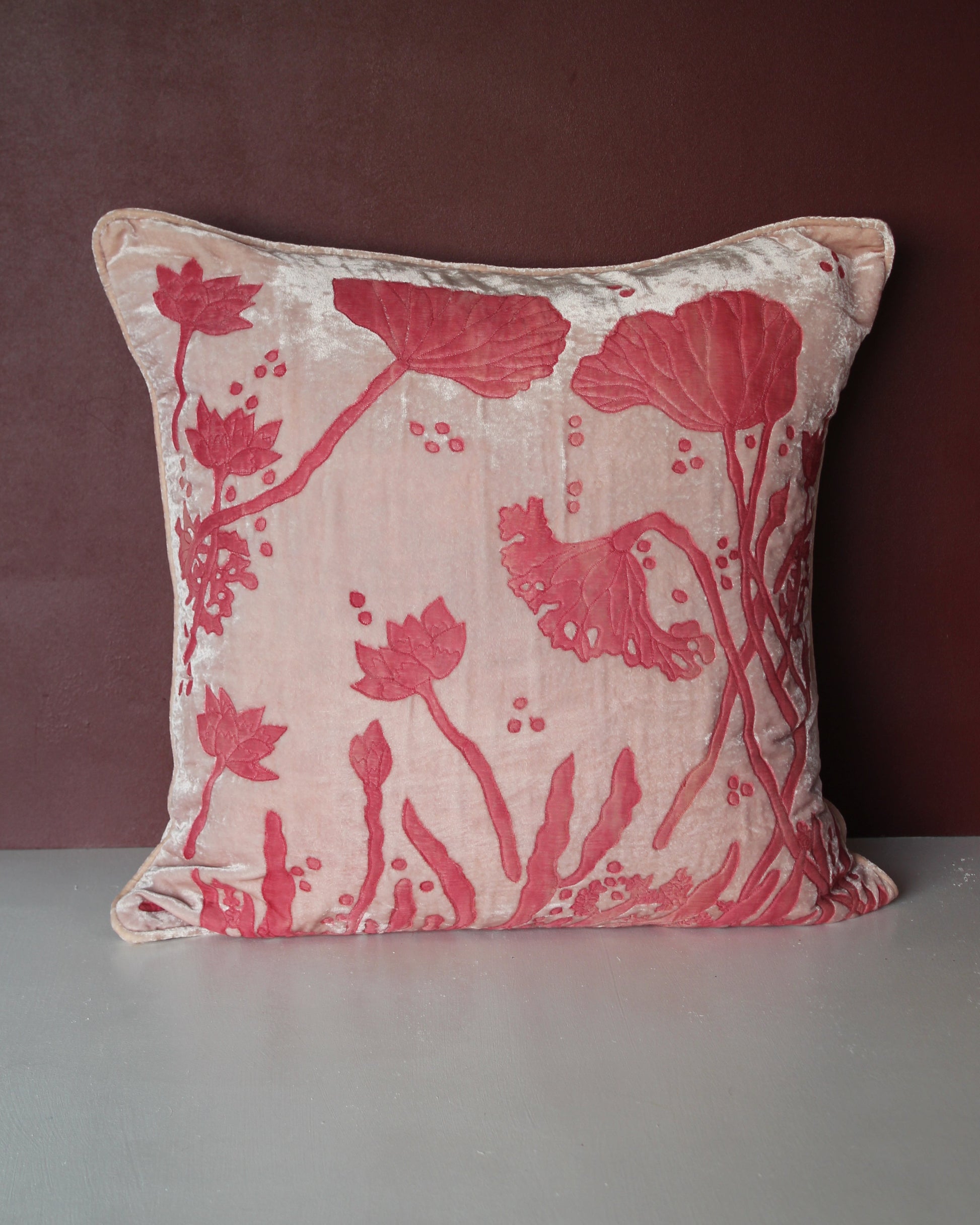 Anke Drechsel Waterlily silk velvet cushion in rose quartz, 50x50cm, featuring a deeper pink devoré lotus and waterlily design on a pale blush ground.