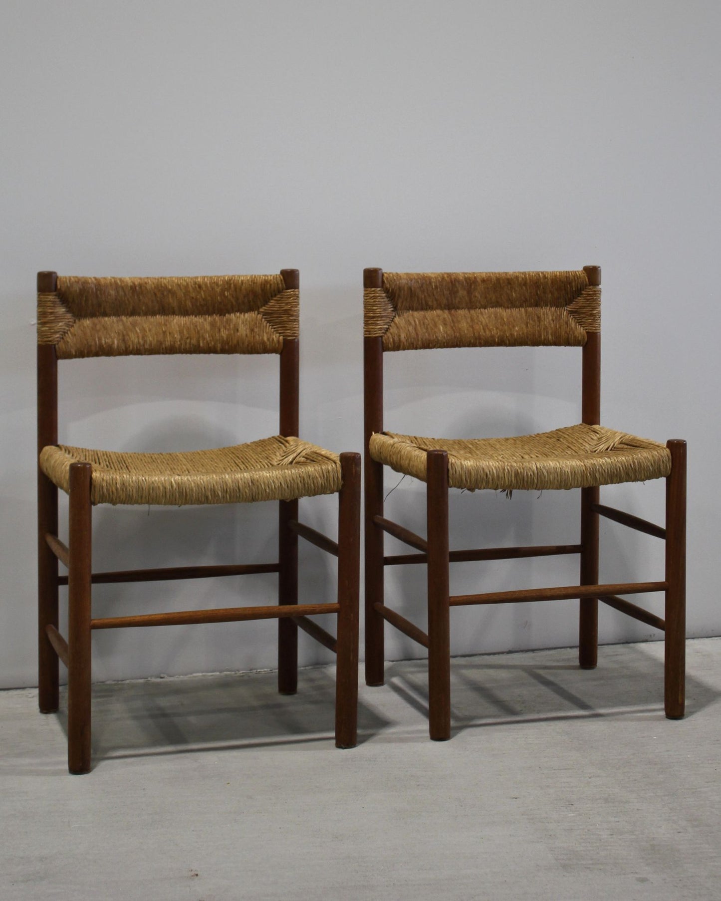Pair of Dordogne dining chairs attributed to Charlotte Perriand, solid timber with woven rush seat and back, vintage French design, New Zealand