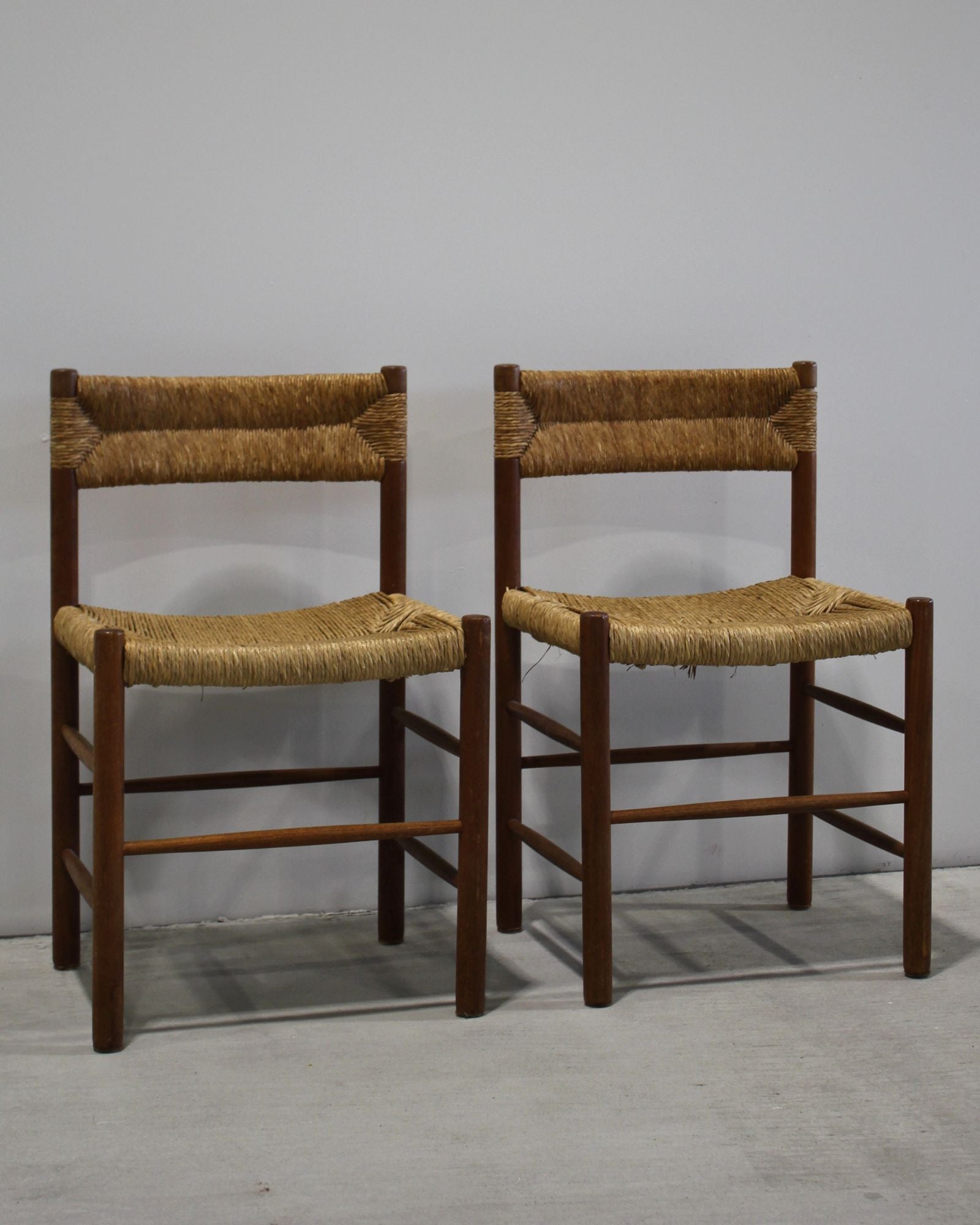 Pair of Dordogne dining chairs attributed to Charlotte Perriand, solid timber with woven rush seat and back, vintage French design, New Zealand