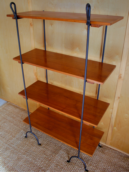 Wooden shelf with metal legs against a plain wall