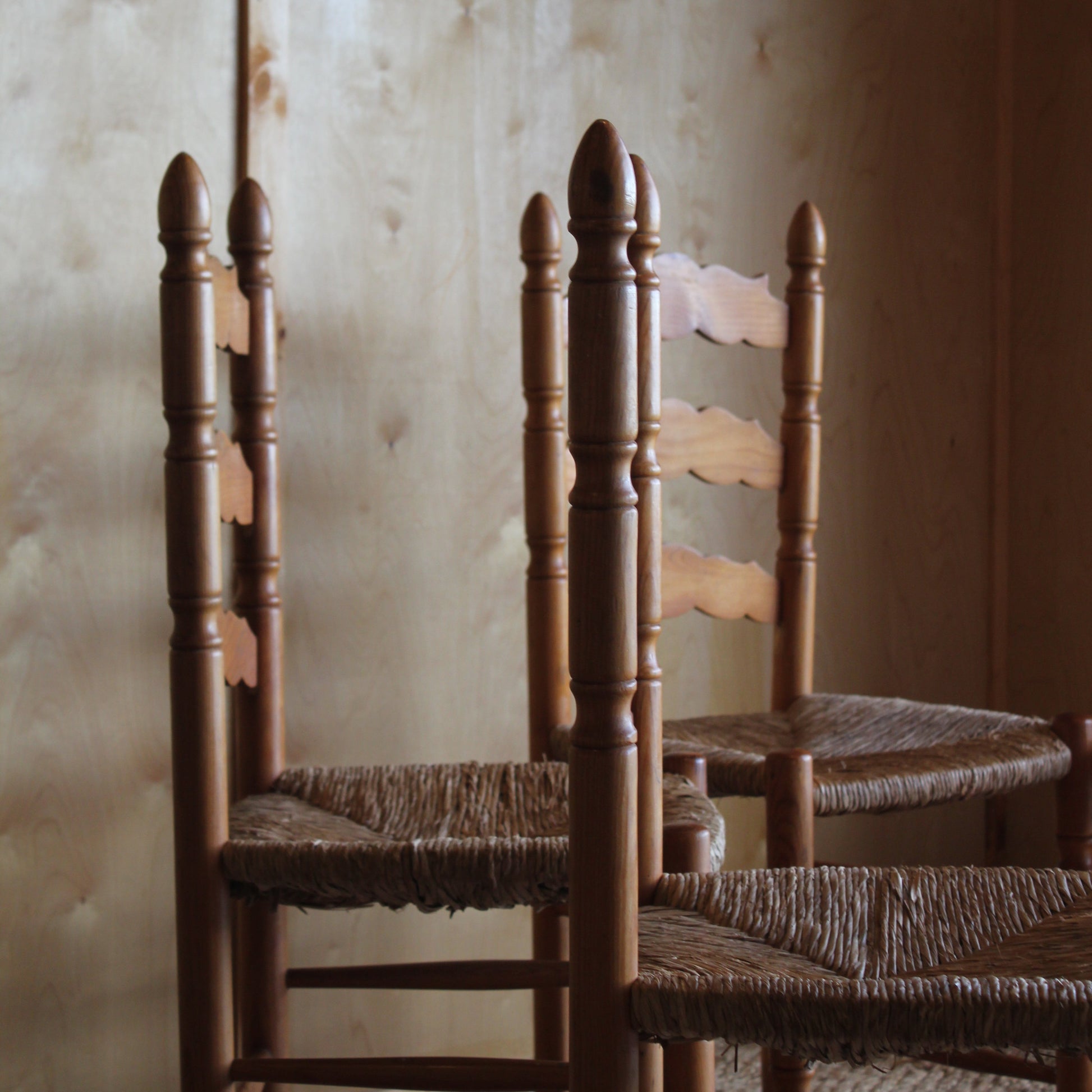Close-up of a wooden chair with a blurred background