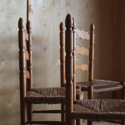Close-up of a wooden chair with a blurred background
