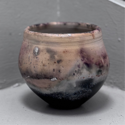 Ceramic pot with a textured beige and dark brown glaze 