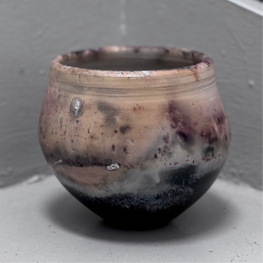 Ceramic pot with a textured beige and dark brown glaze 