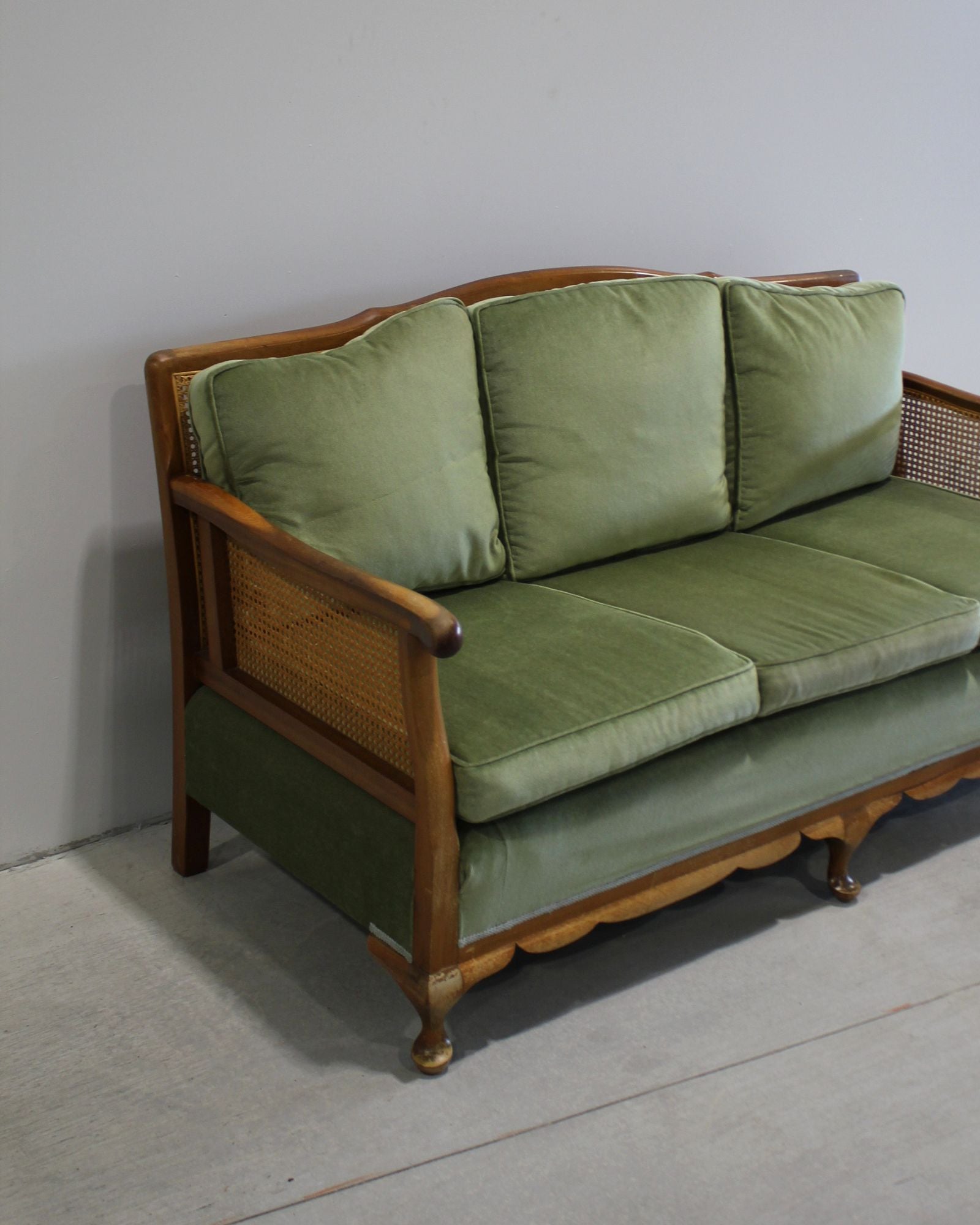 Vintage Bergère style cane sofa in deep green velvet, timber frame, preloved French inspired furniture, New Zealand