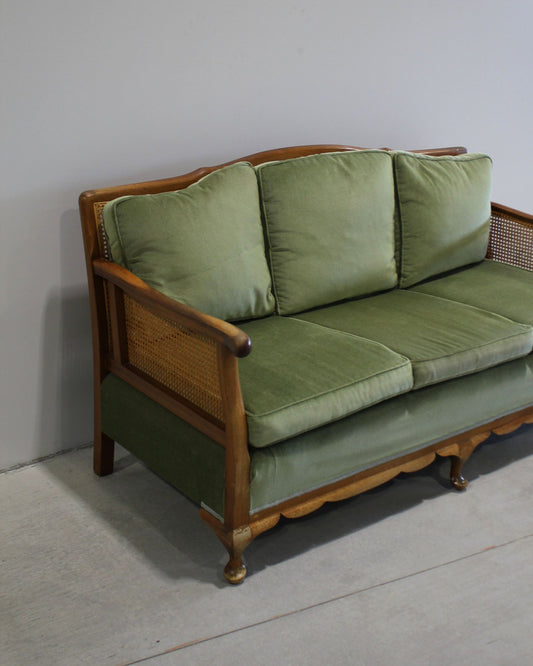 Vintage Bergère style cane sofa in deep green velvet, timber frame, preloved French inspired furniture, New Zealand
