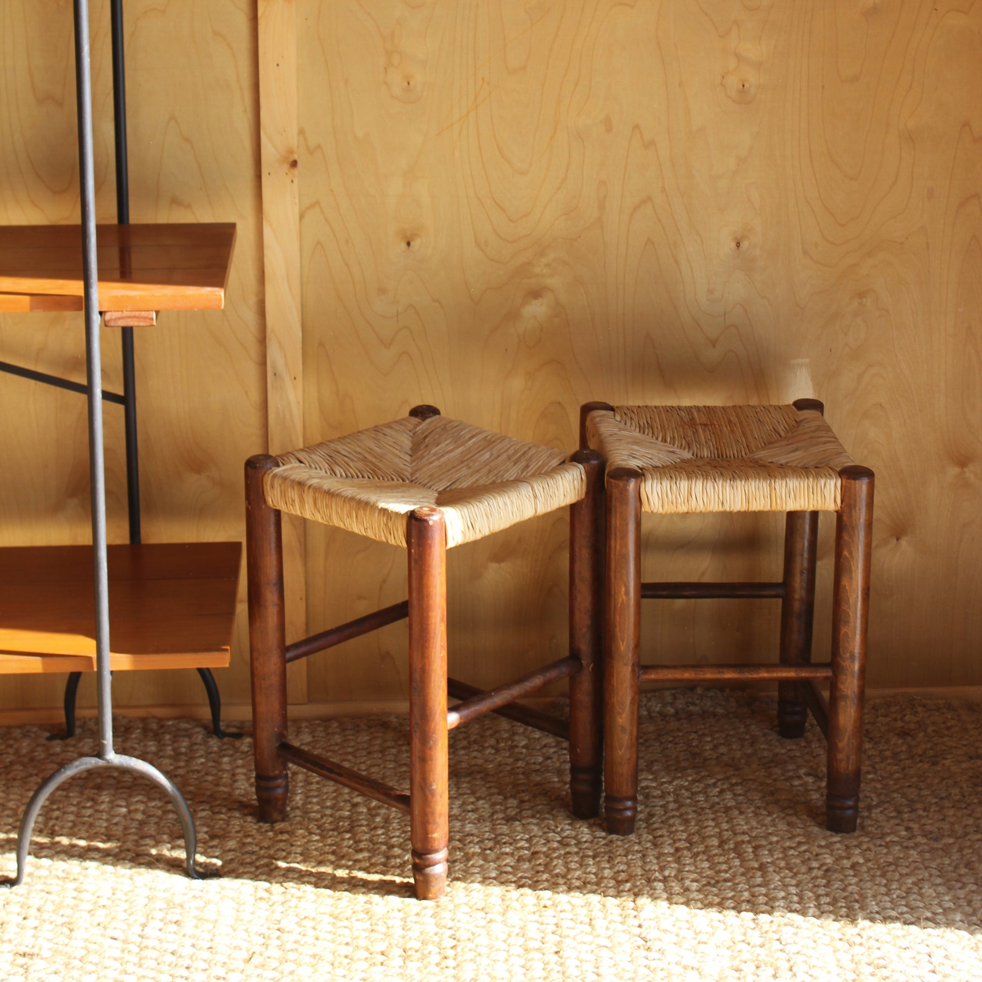 Vintage tools stool against a wooden wall