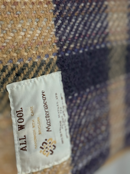 Close-up of a Masterweave label on a textured fabric background